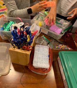 This is the 3rd-5th grade support group picking out activities to do. There are different activities options in the child groups if they don’t want to talk about their grief and instead want a distraction. Activities include bracelet making, drawing, model magic, sand art, play dough, etc. 